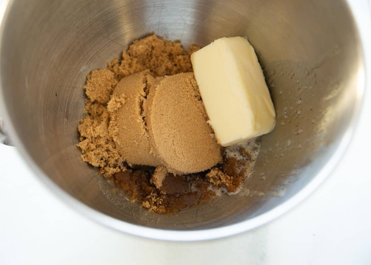 Brown sugar and butter in a mixing bowl.