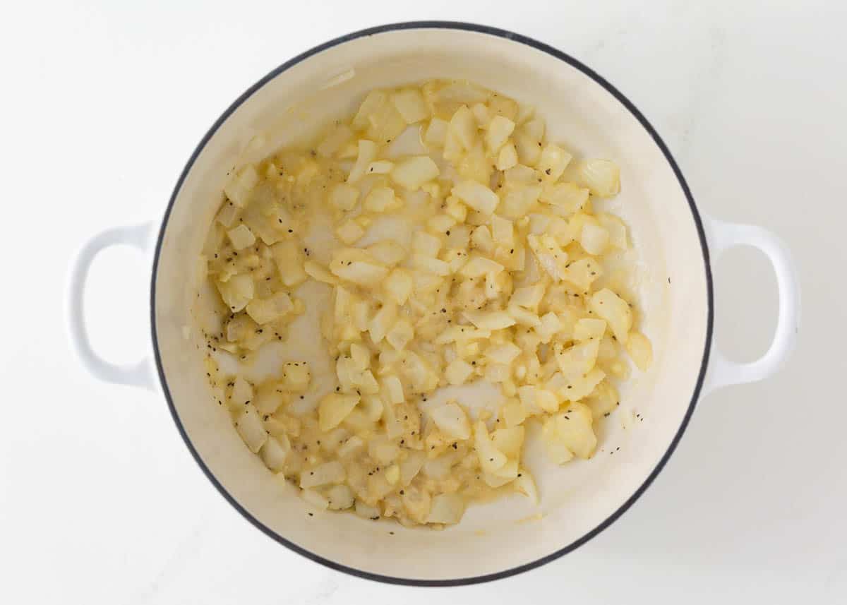 Sauteed onions with garlic and butter in a skillet.