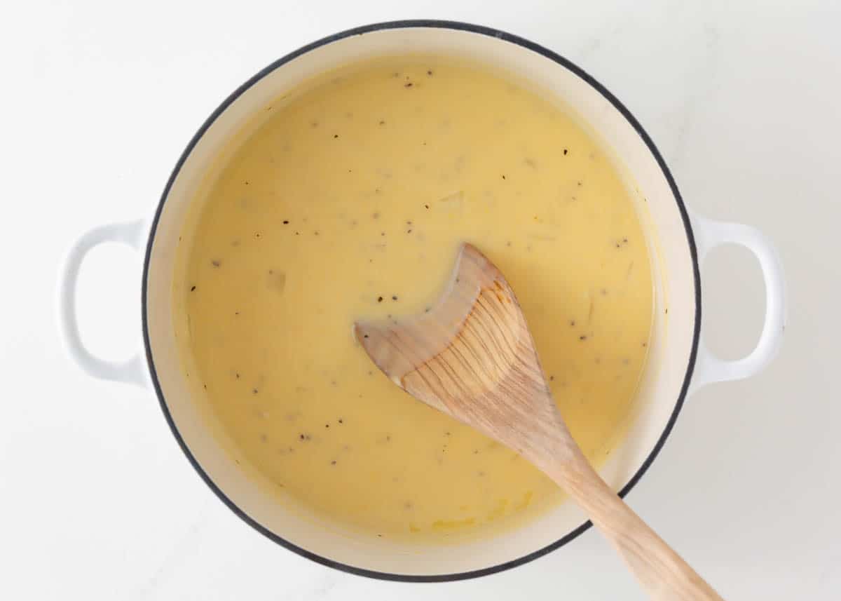 Making a creamy cheese sauce. 