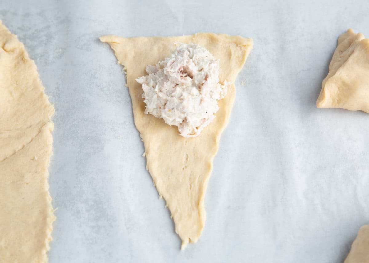 Chicken mixture on a crescent roll.