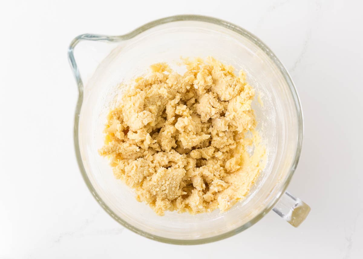 Dough for linzer cookies in a large glass measuring dish.