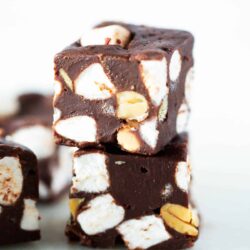 The best rocky road fudge stacked on a plate.