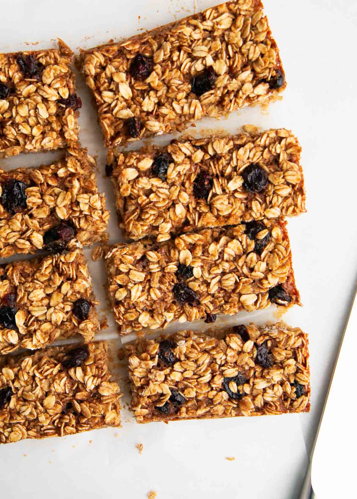 Oatmeal breakfast bars cut into pieces on the counter.