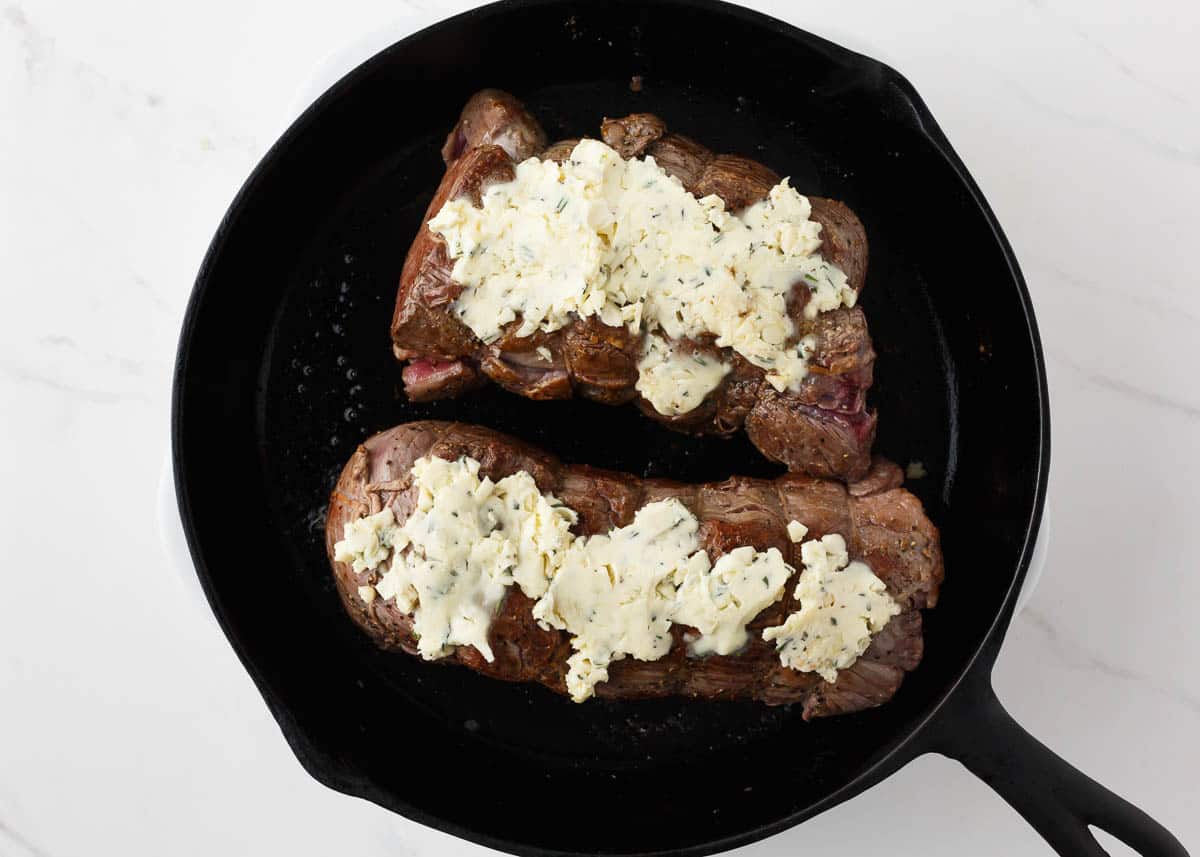 Garlic butter spread over tenderloin.