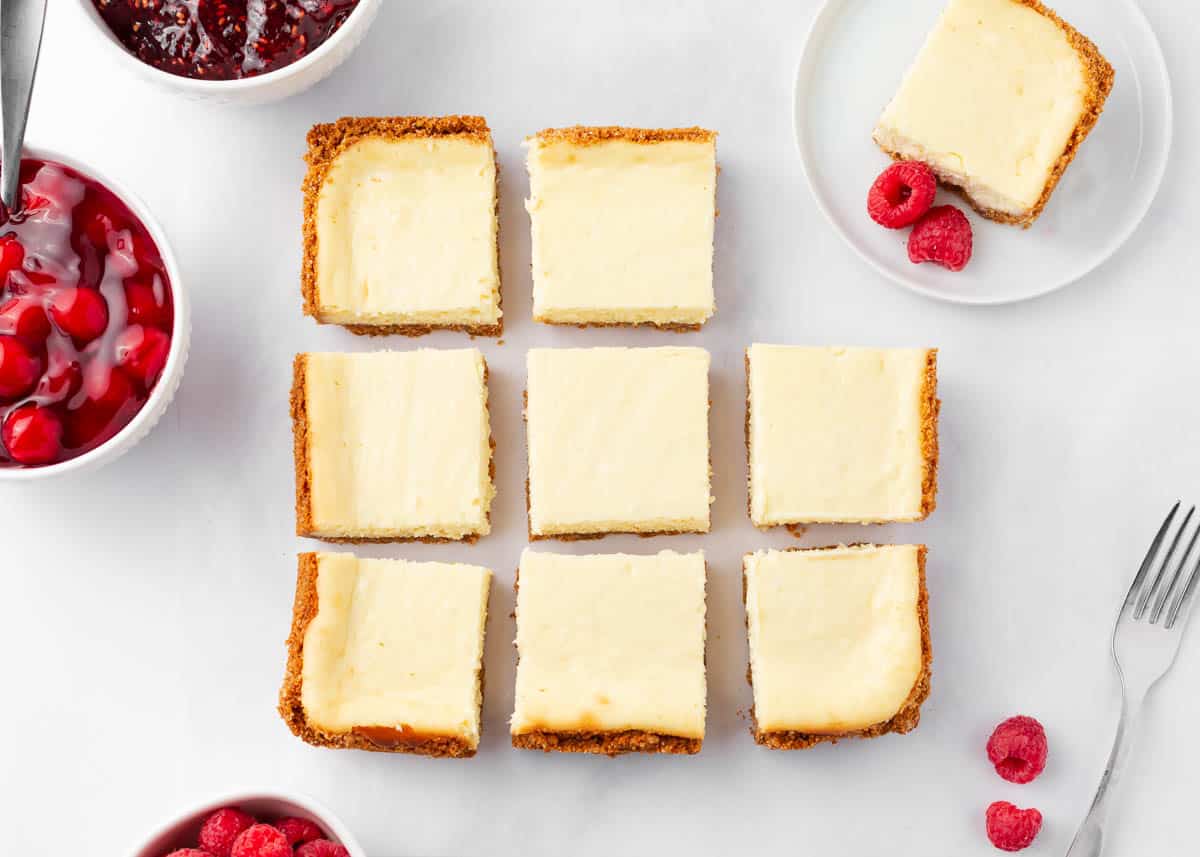 Cheesecake bars cut into squaress.