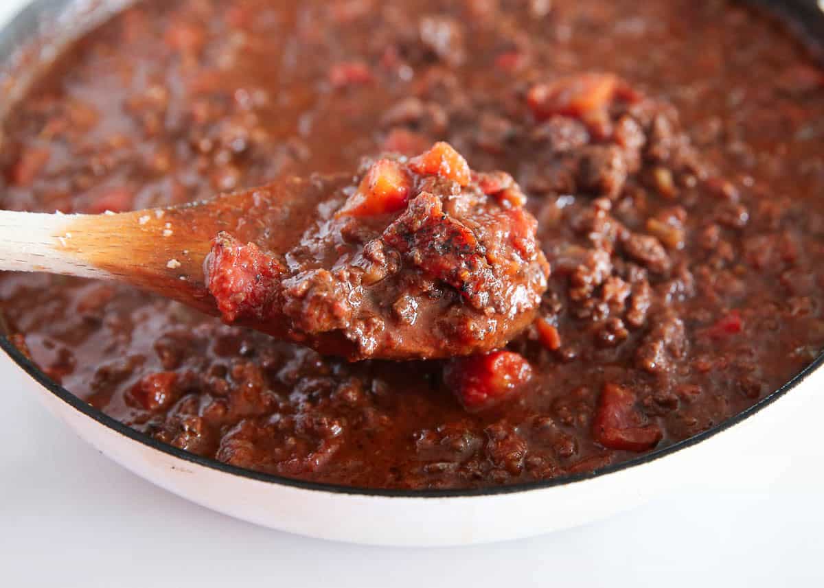 Close up of spaghetti bolognese sauce on a spoon.