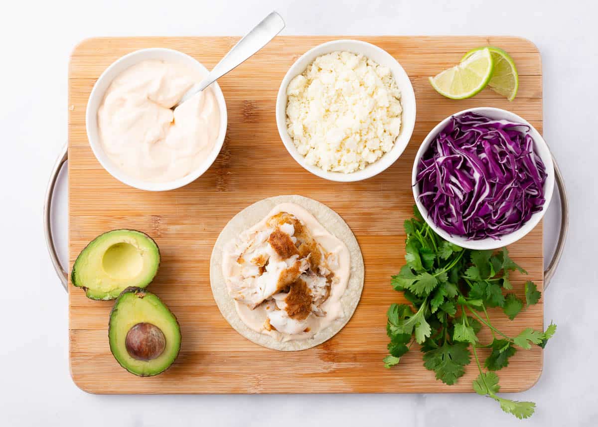 Assembling a tilapia fish taco.