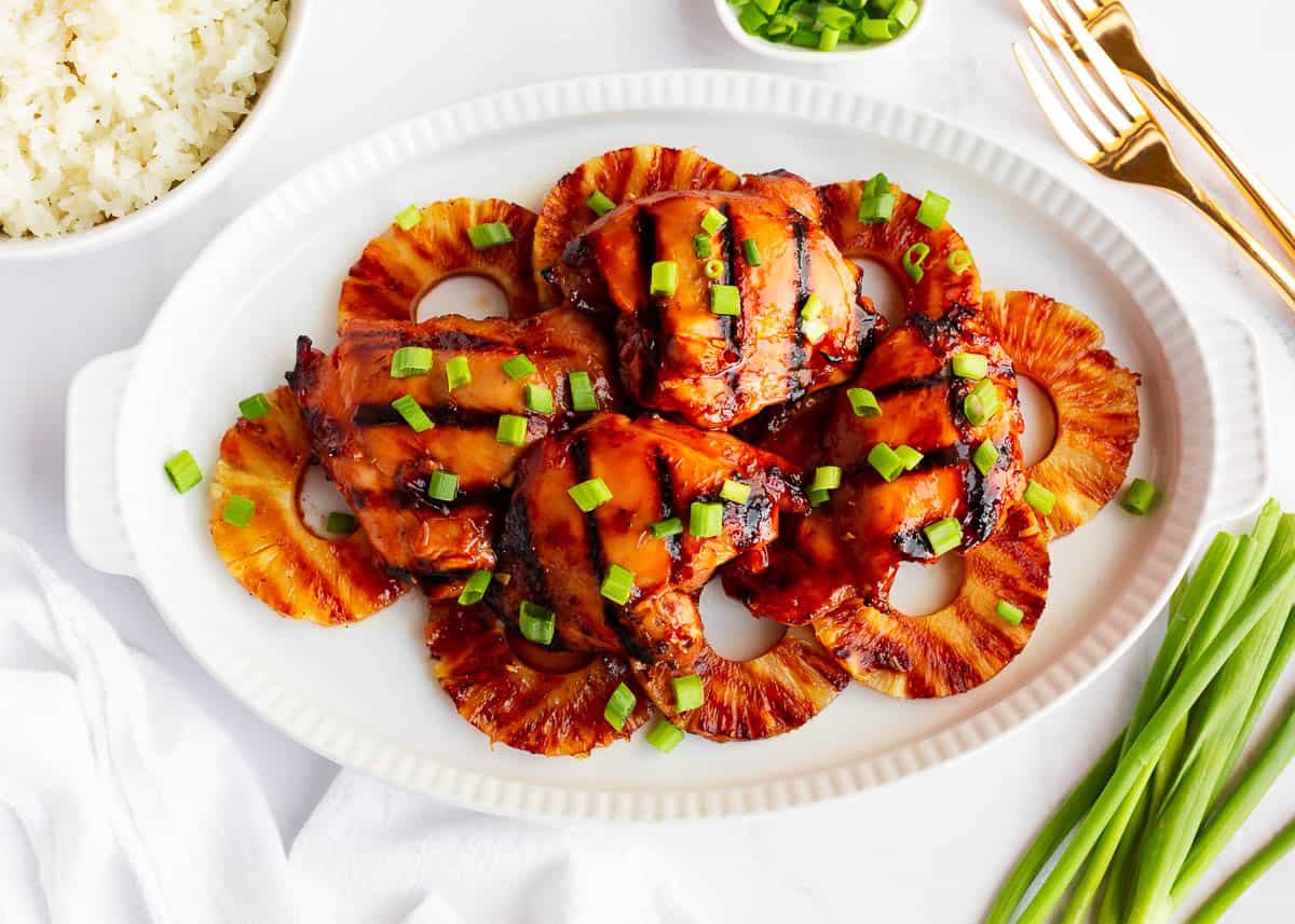 Huli Huli chicken with pineapple on a plate.