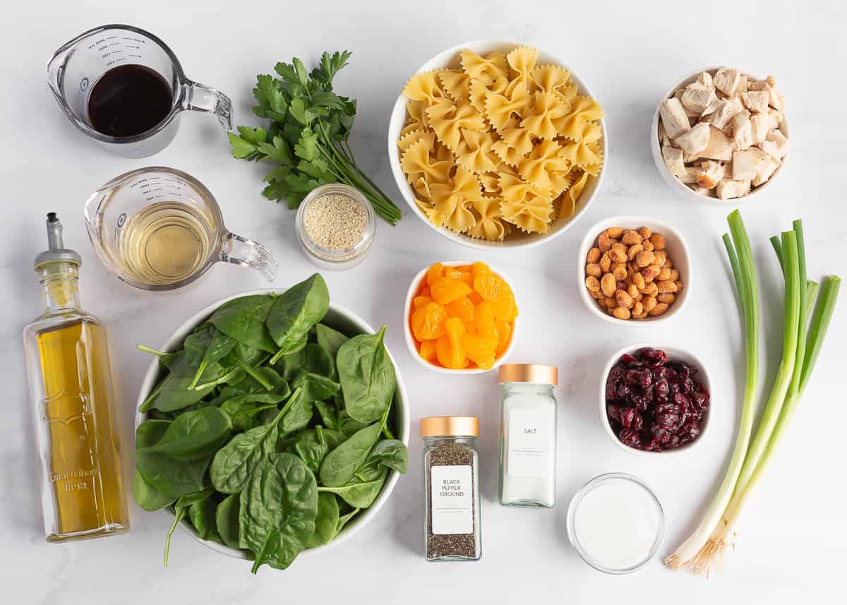 Spinach pasta salad ingredients on the counter.