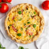 Tomato pie on a pie dish.