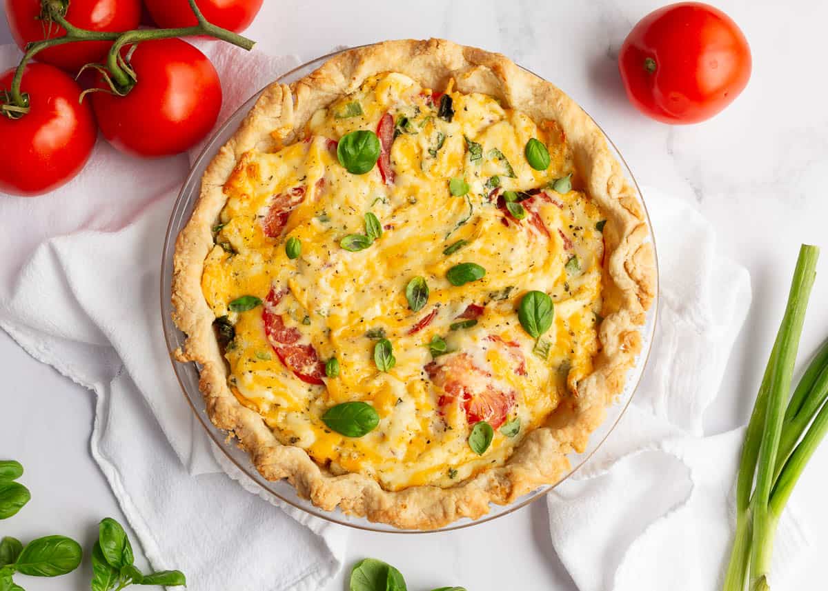 Tomato pie on a pie dish.