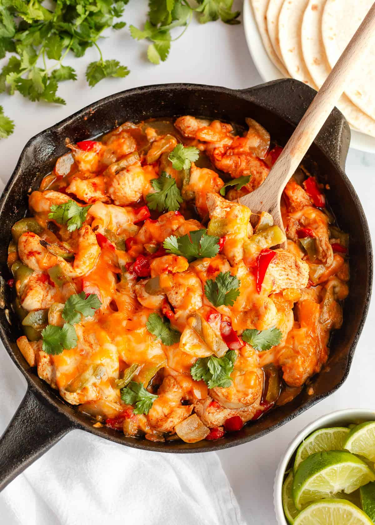 Chicken fajita casserole in a skillet.