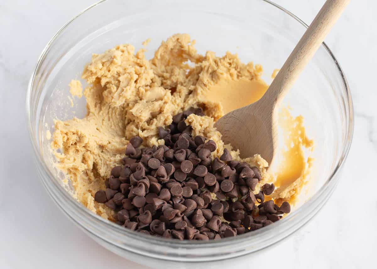 Cookie dough batter in a bowl with chocolate chips.