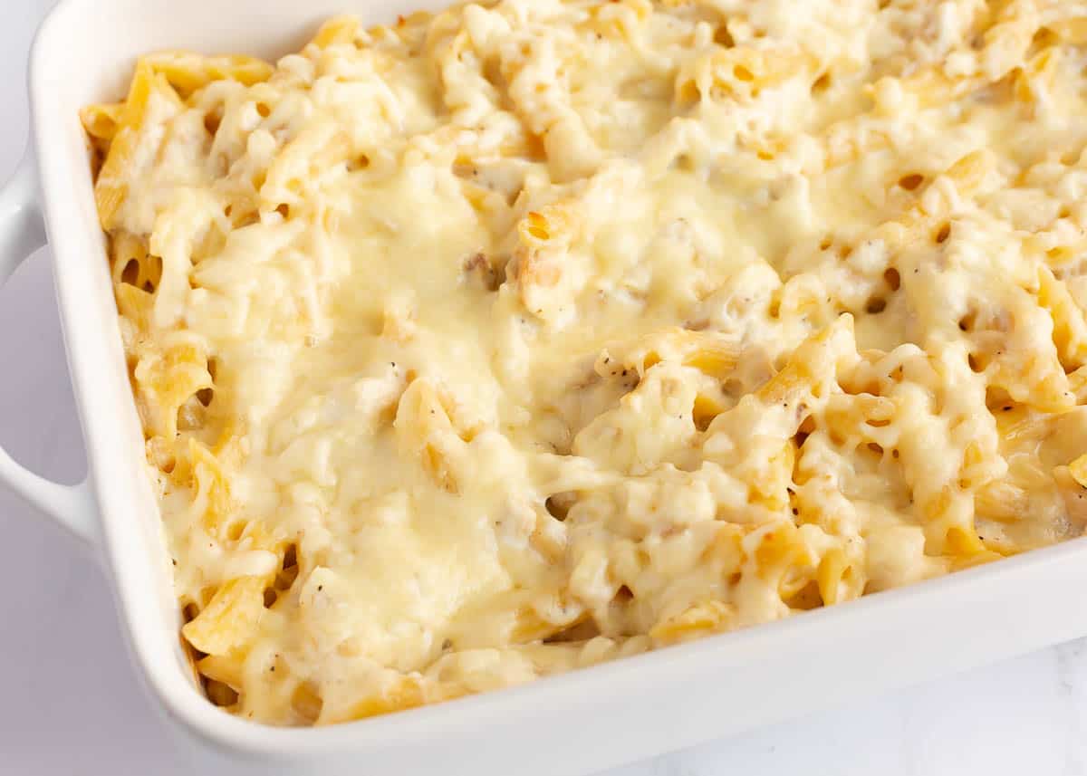 Chicken alfredo bake baked ina. white baking dish.