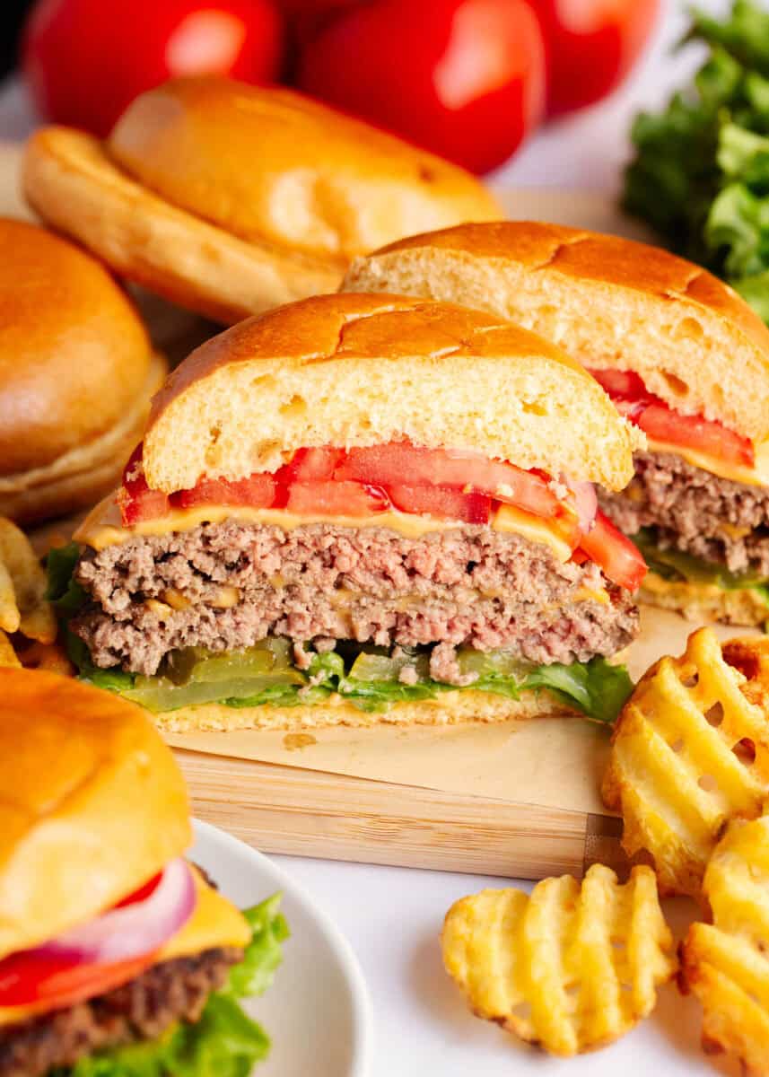 A smash burger cut in half to show the inside of the burger.