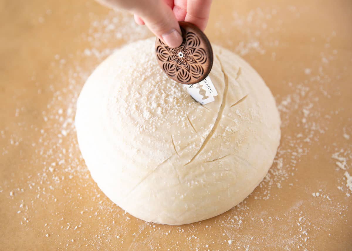 Scoring sour dough bread.