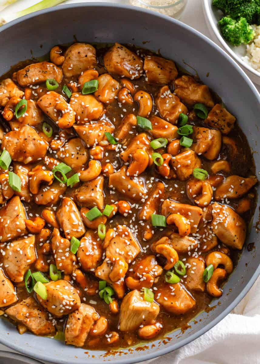 Cashew chicken in a skilelt.