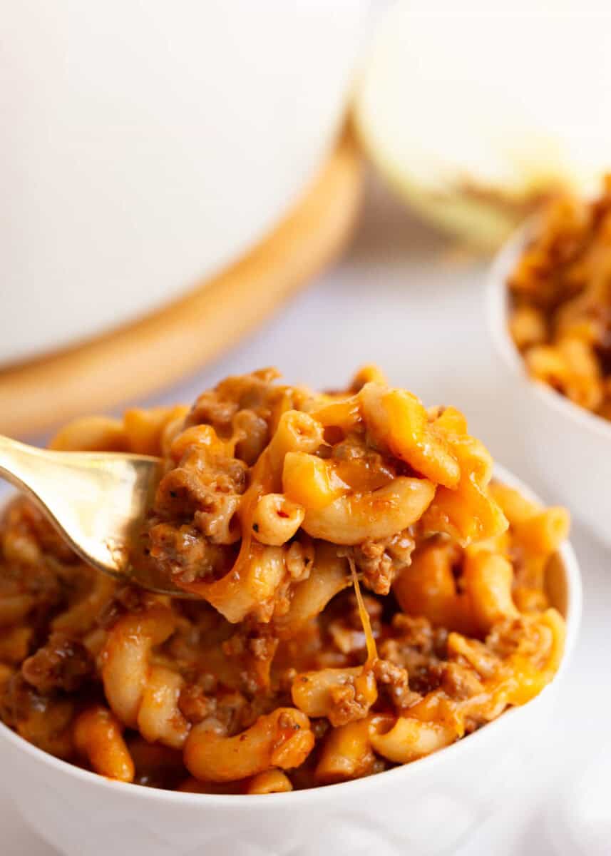 Cheeseburger casserole in a small white serving dish.