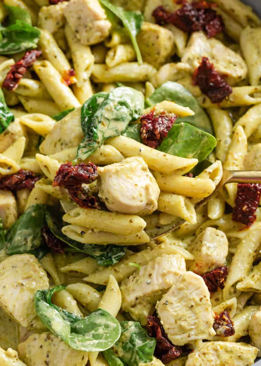 Close up photo of chicken pesto pasta.