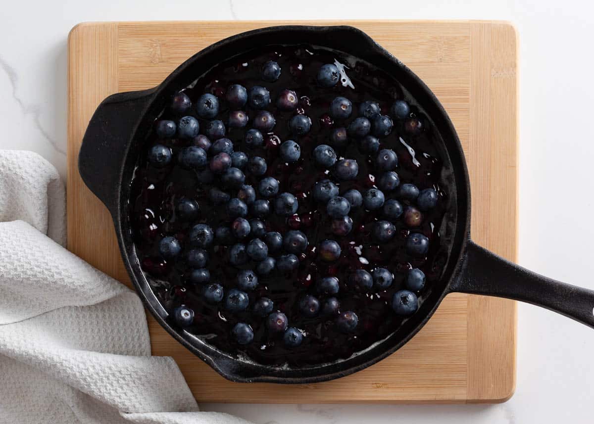 Blueberry pie filling and fresh blueberries in a large skillet. 