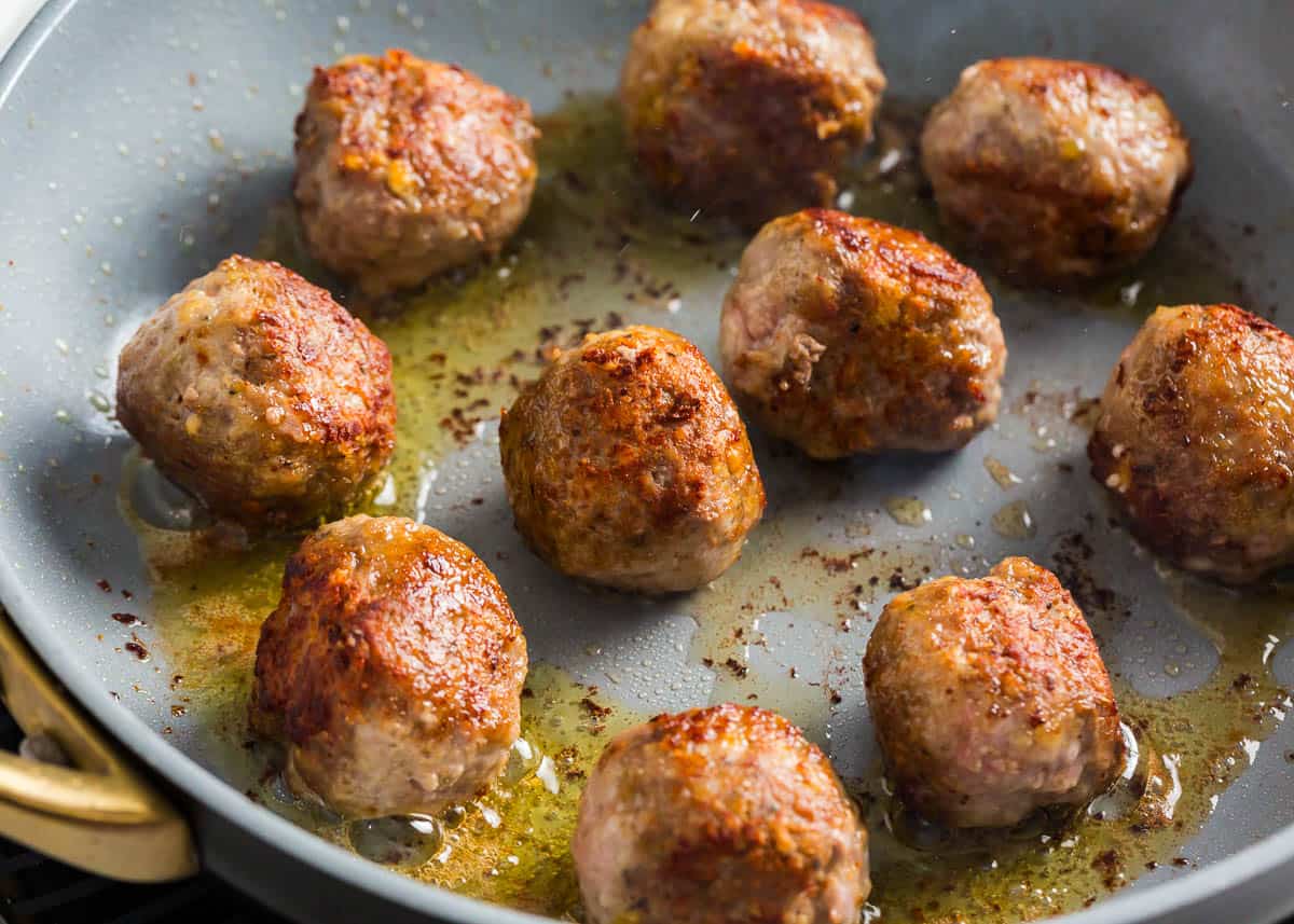 Cooked meatballs in the skillet.