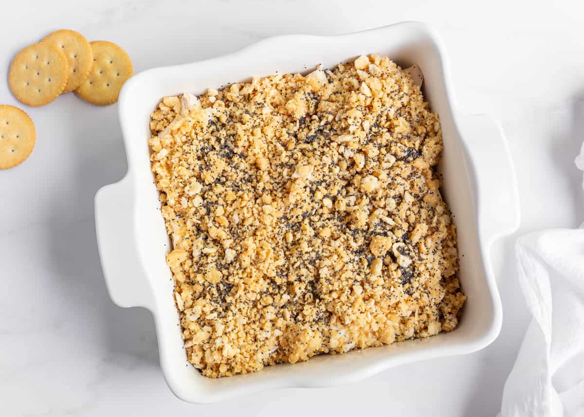 Unbaked poppy seed chicken casserole in baking dish.