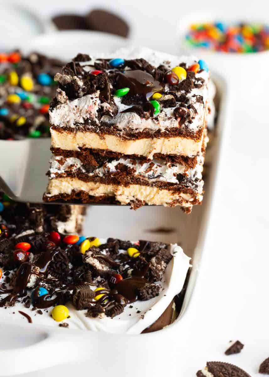 A slice of ice cream sandwich cake being served from the pan.