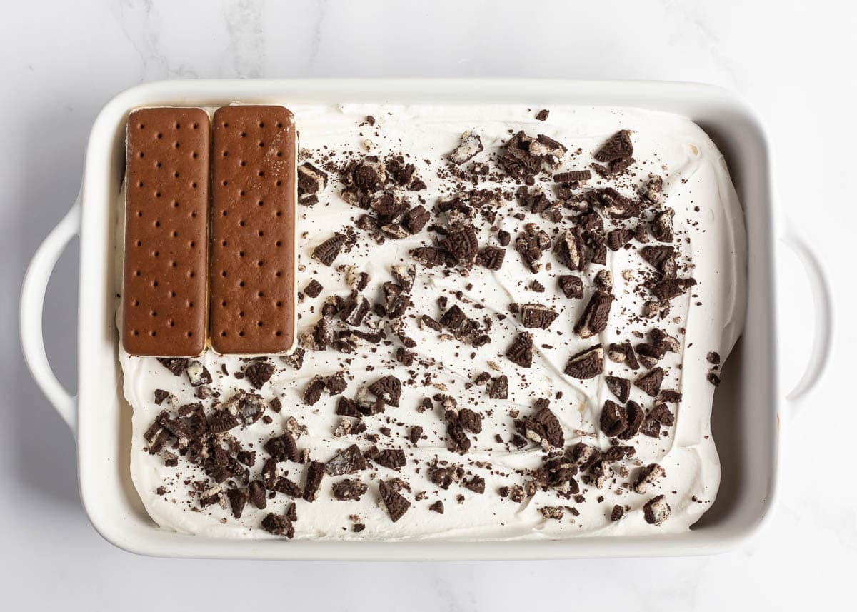 Showing how to make ice cream sandwich cake.