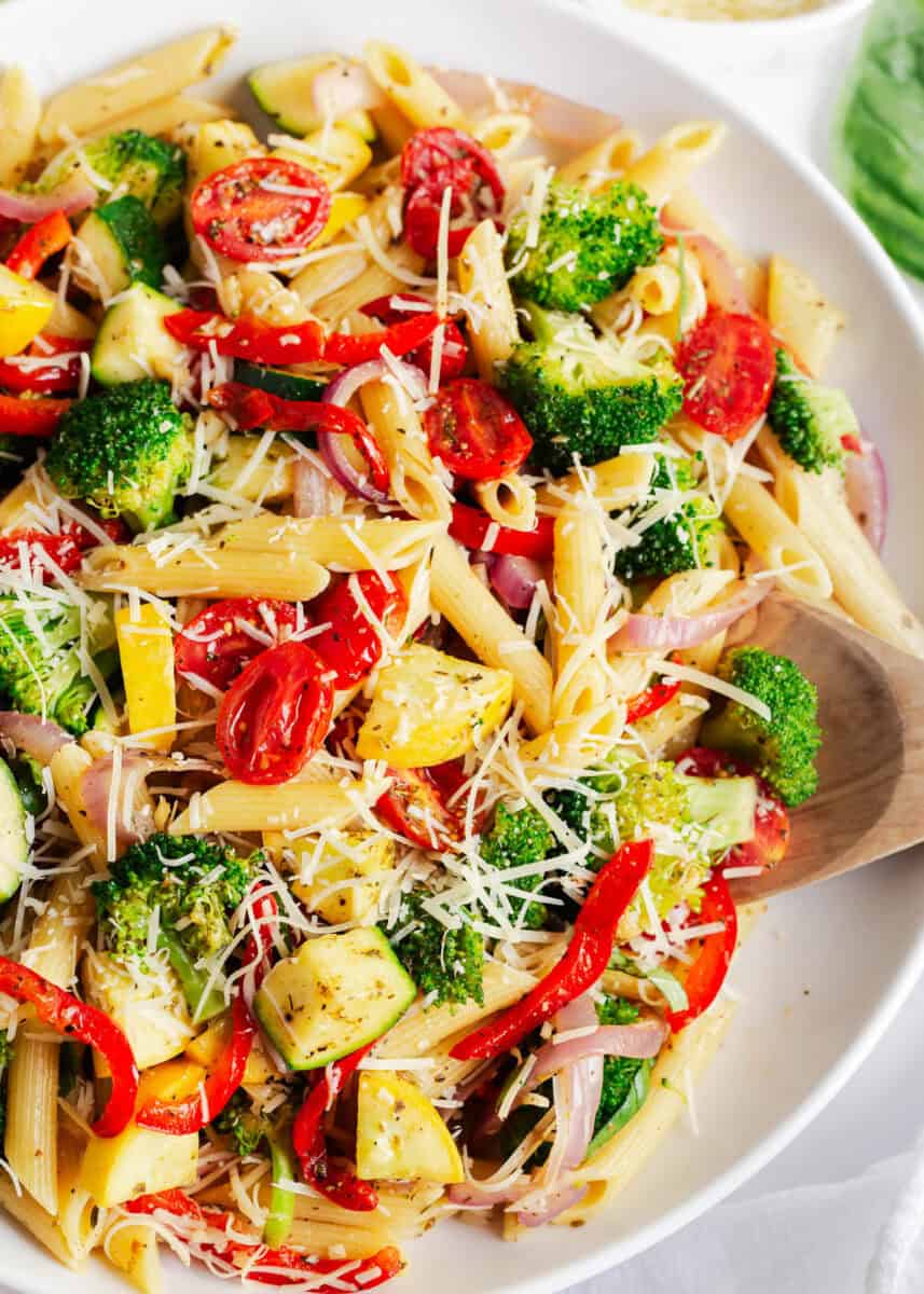 Pasta primavera in a white bowl.