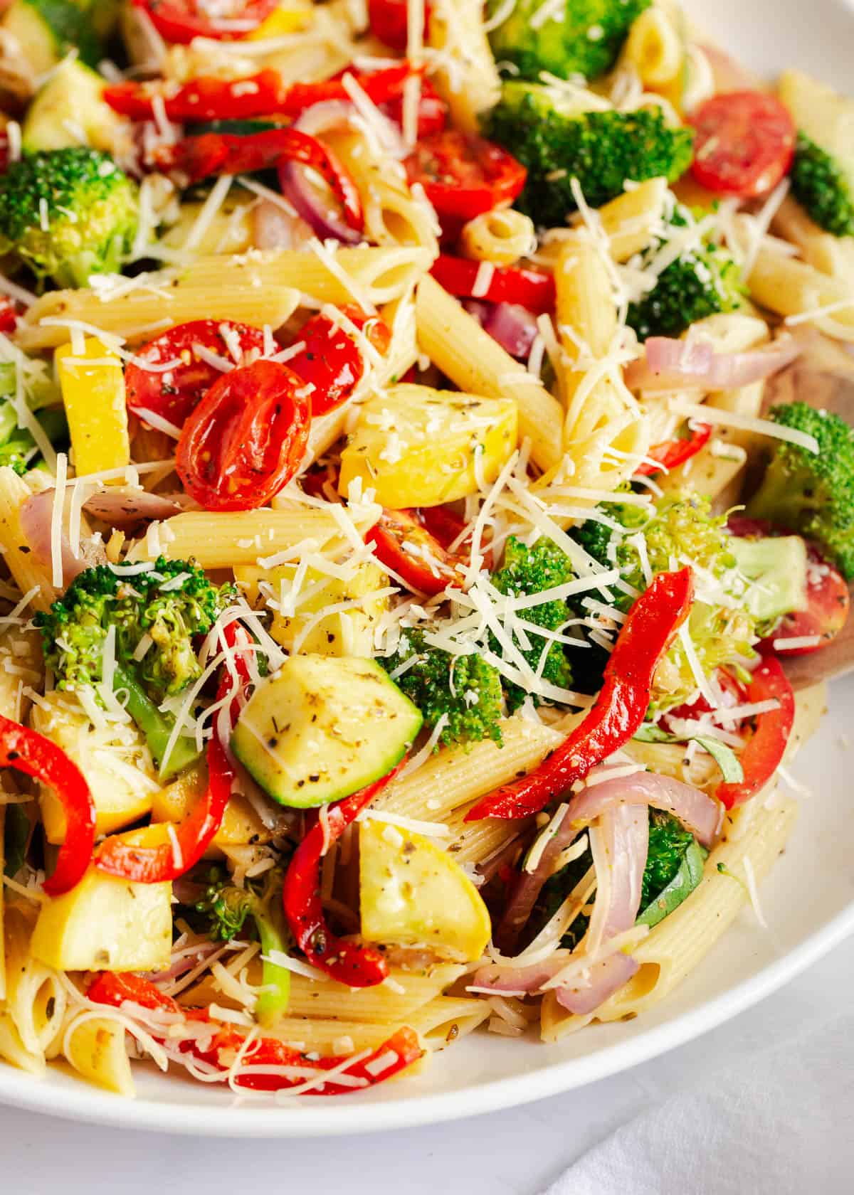 A close up photo of pasta primavera. .