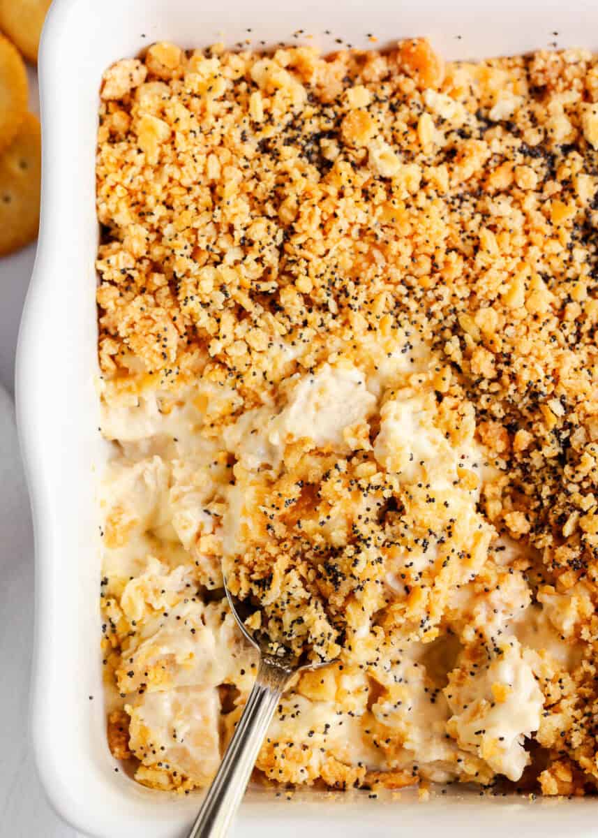 Poppy seed chicken casserole recipe in white baking dish.