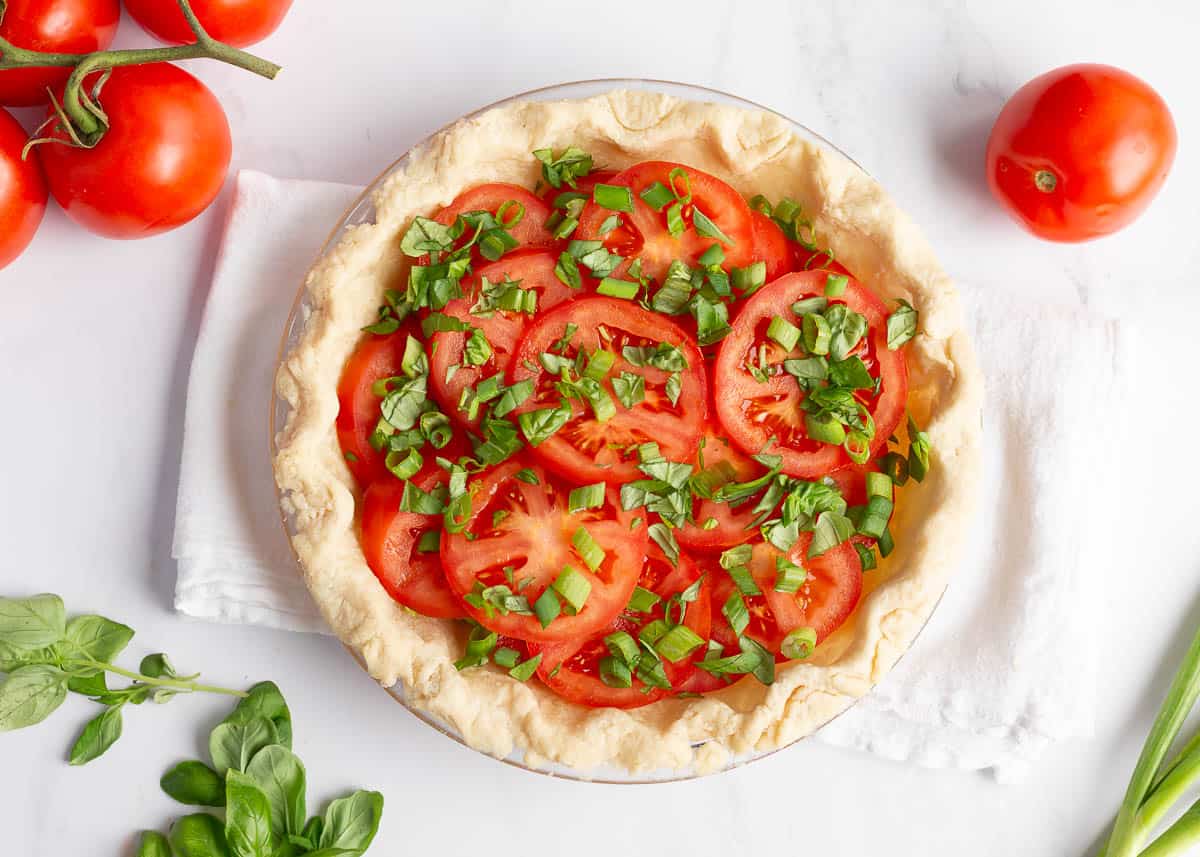 Fresh tomatoes in a pie crust.