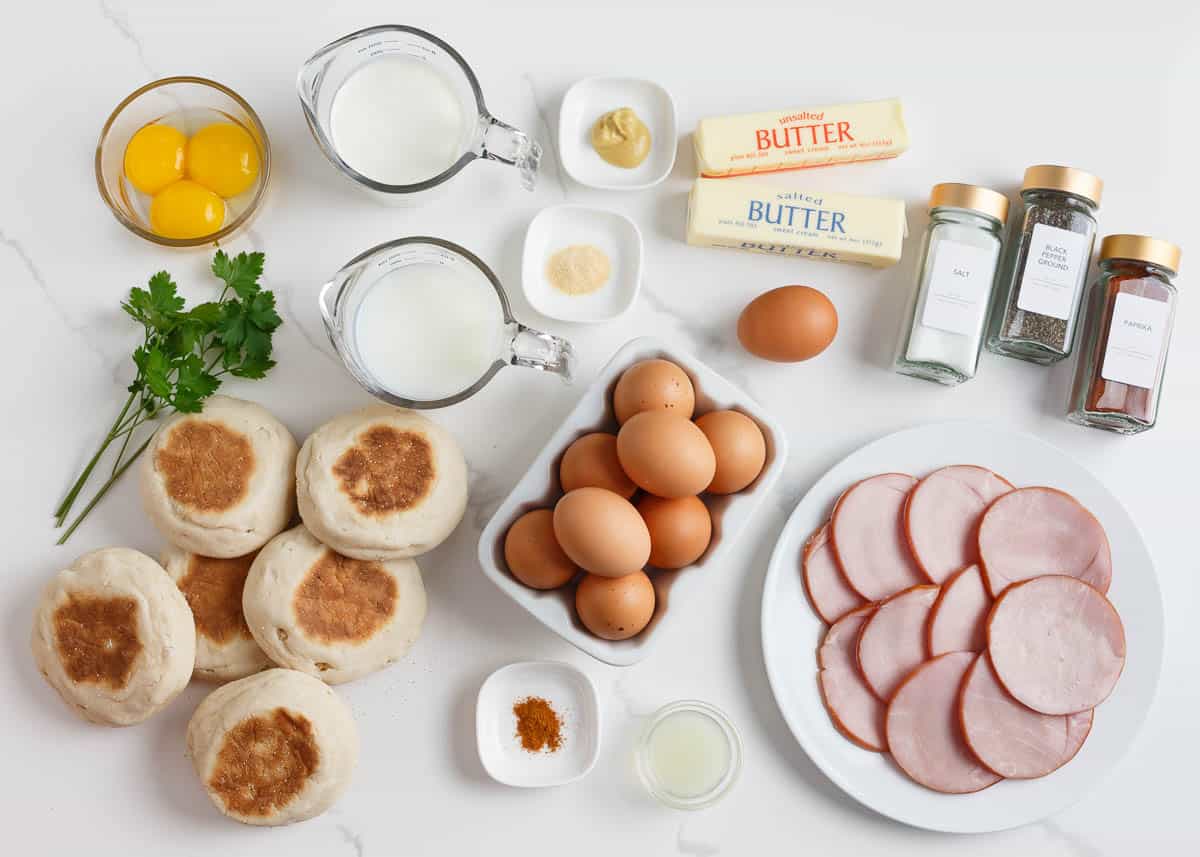 English muffins, eggs, canadian bacon, milk, butter and seasonings for eggs benedict casserole.