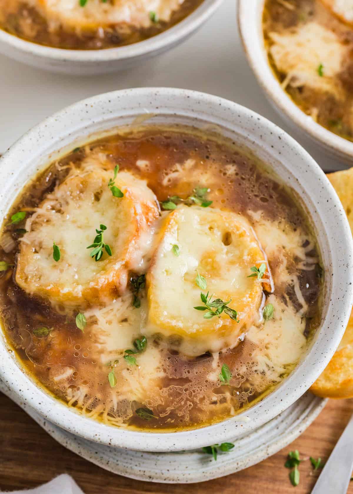 French onion soup in a white bowl.