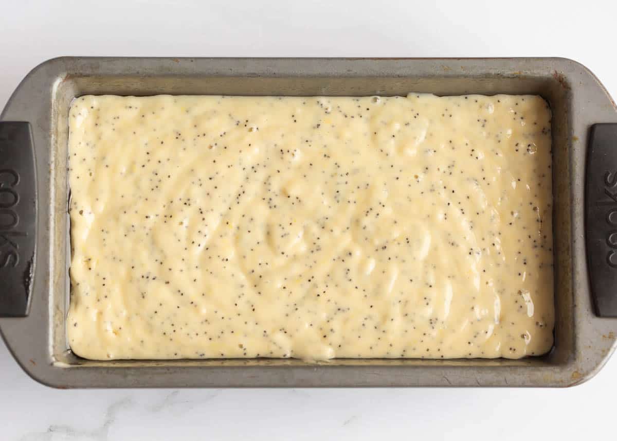 Lemon poppy seed bread batter in a loaf pan.