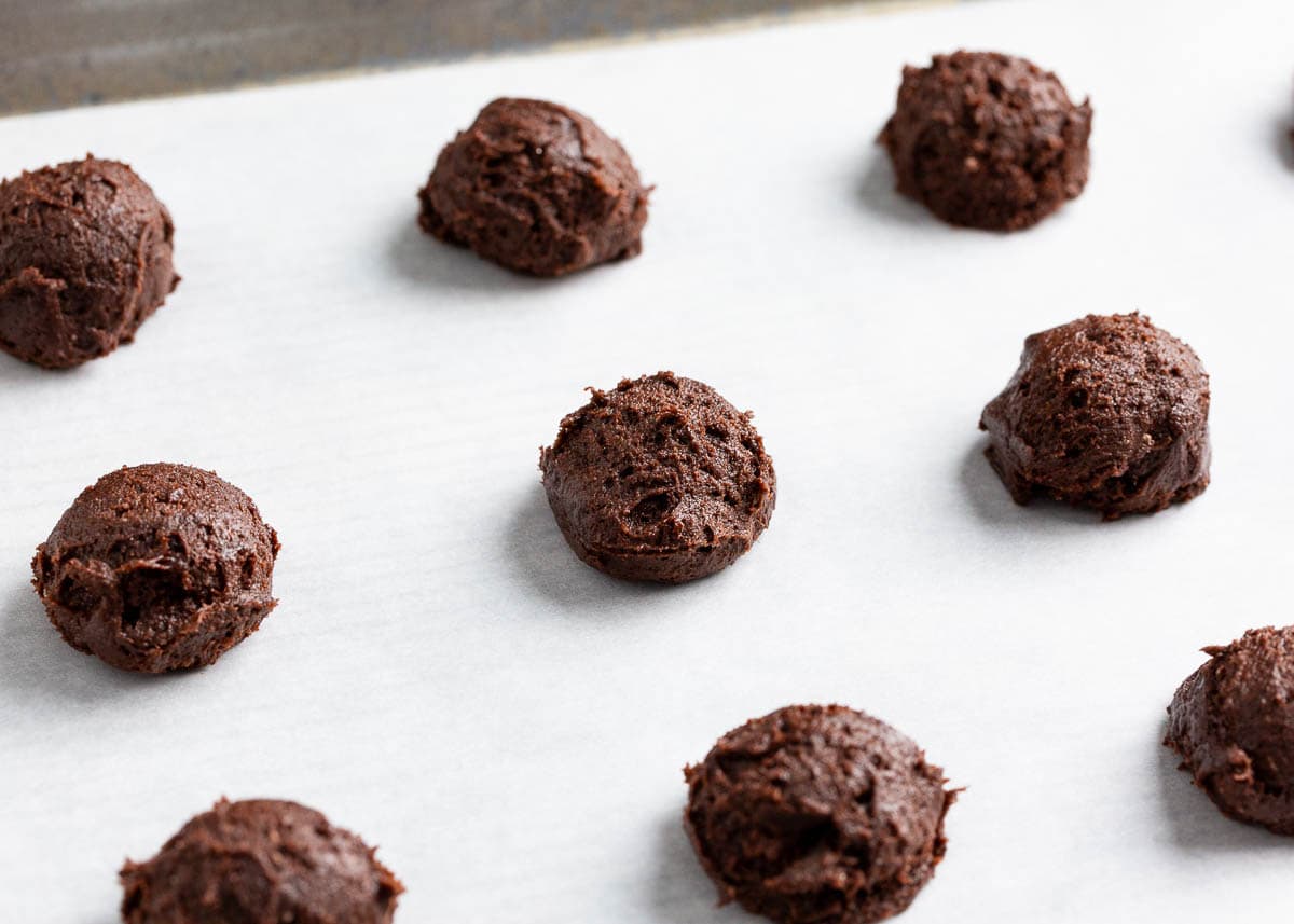 Cookie dough balls on pan.