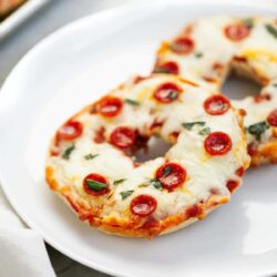 Pizza bagels on a plate.