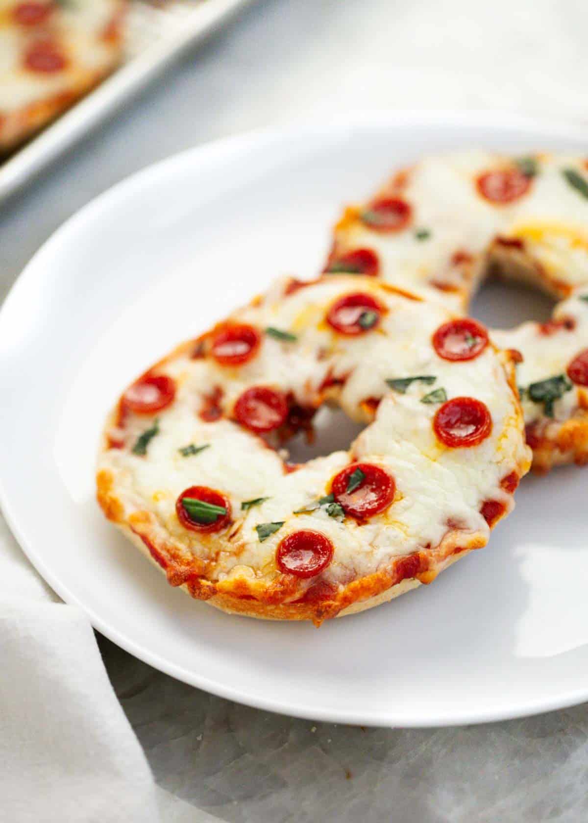 Pizza bagels on a plate.