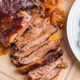 Sliced brisket on a cutting board.