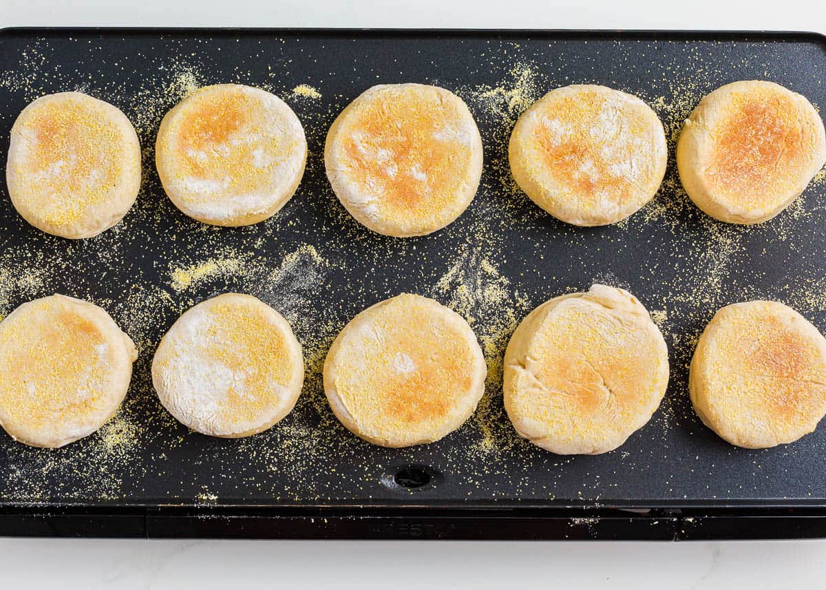 Cooking english muffins on a griddle.