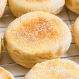 English muffins on a cooling rack.