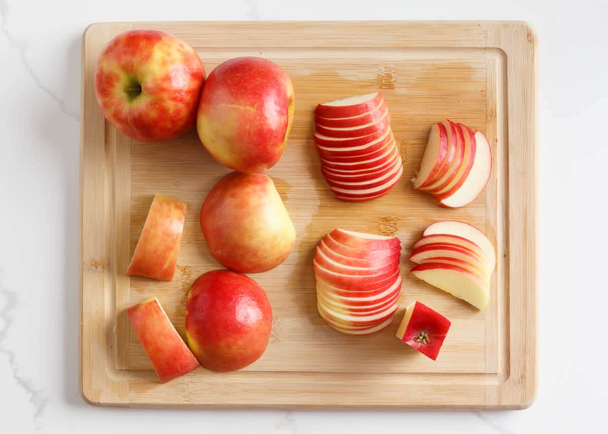 Sliced apples on a cutting board.