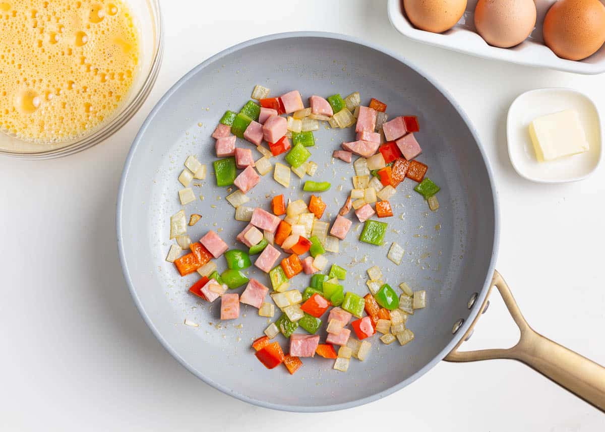 Cooking veggies in a skillet.