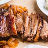 Sliced brisket on a cutting board.