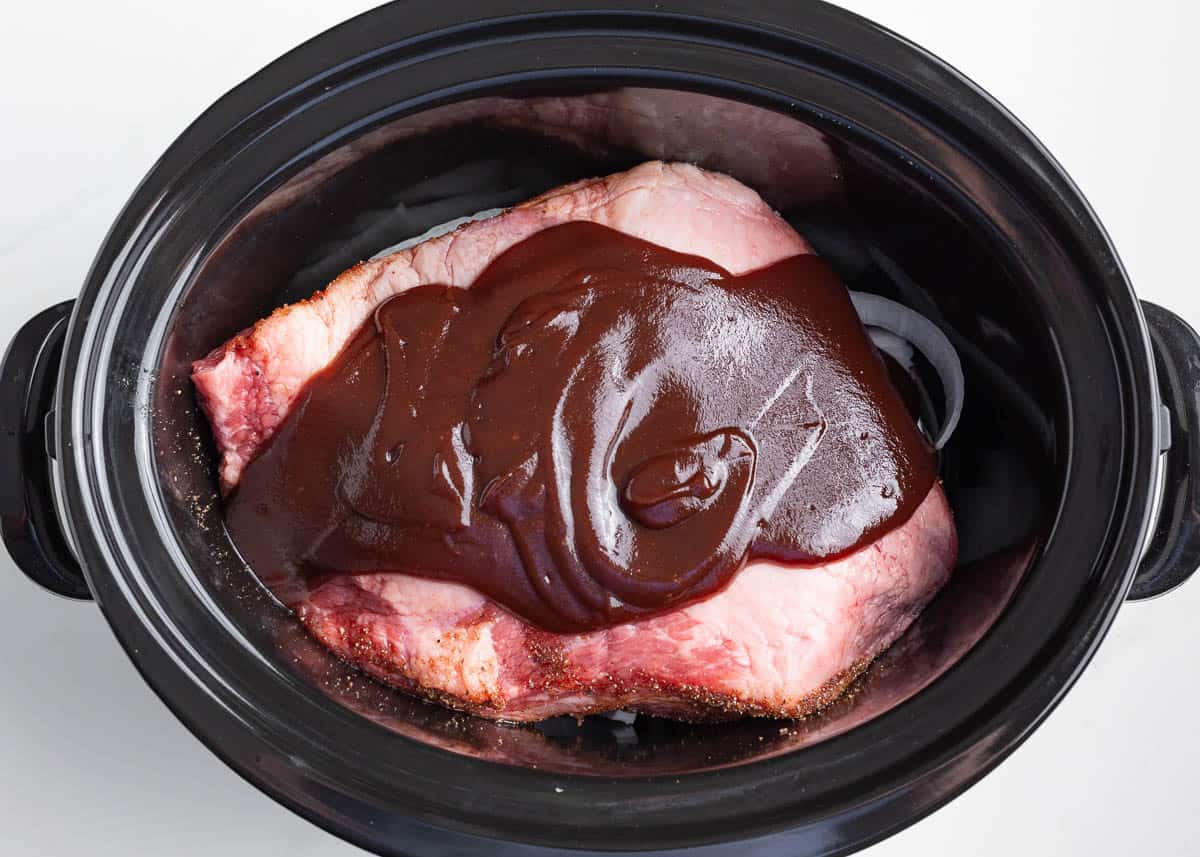 Brisket with sauce in a crockpot.