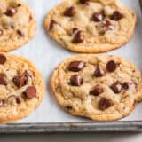 Sourdough chocolate chip cookies on a baking sheet.