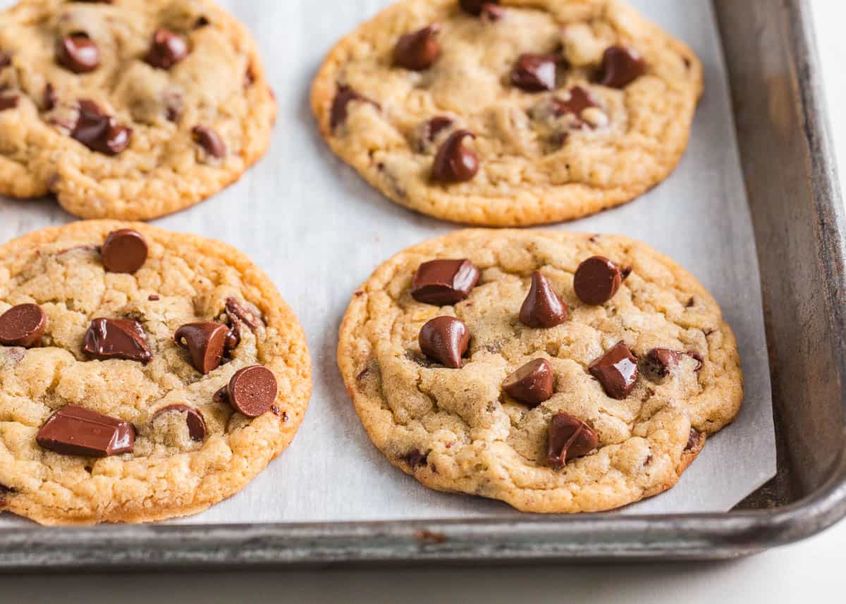 Sourdough chocolate chip cookies on a baking sheet.