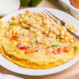 Western omelette on a white plate.