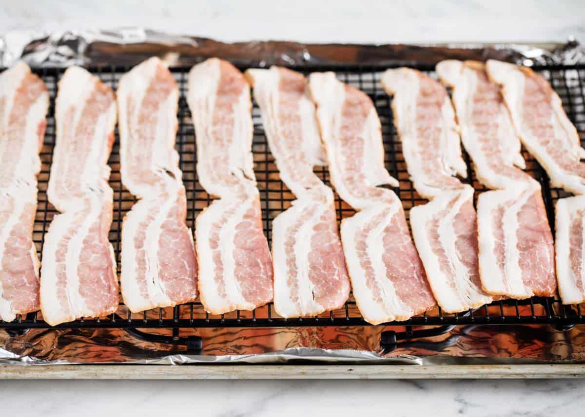 Showing how to cook bacon in oven.