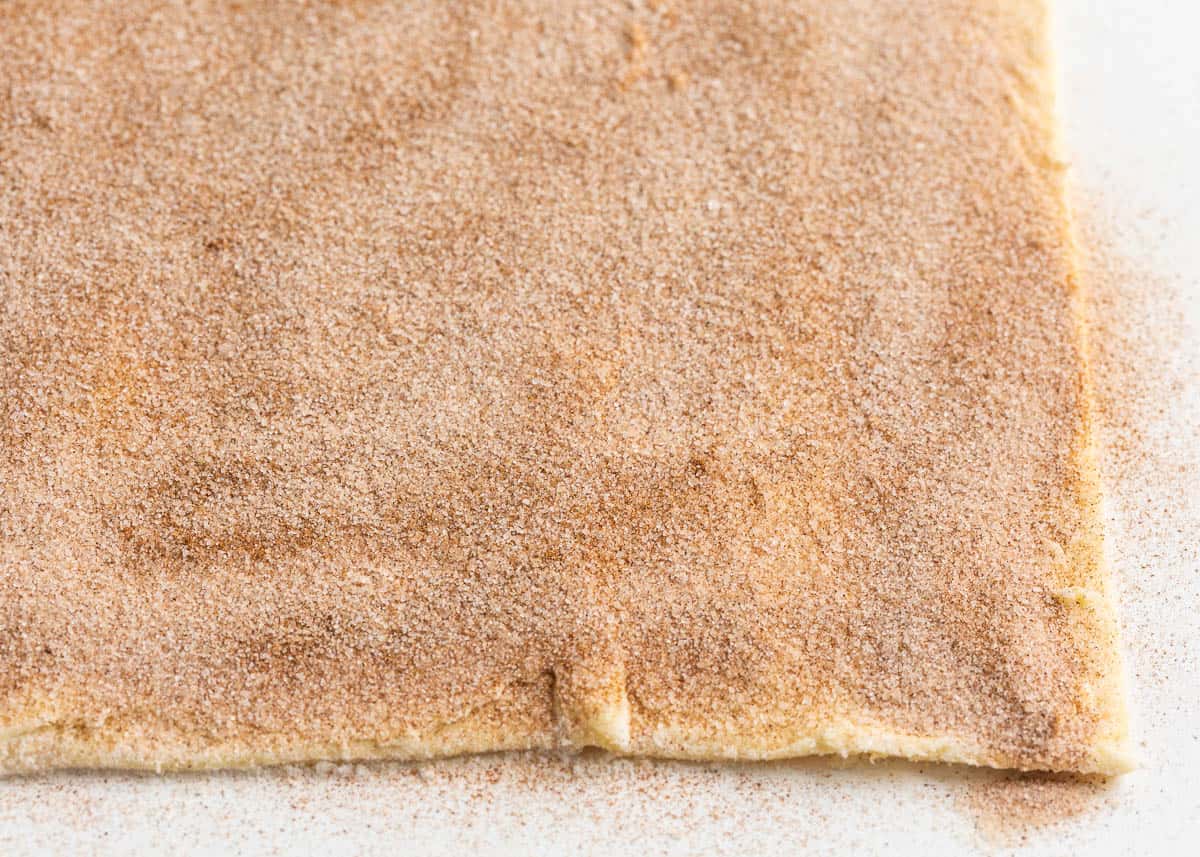 Cinnamon sugar on dough.